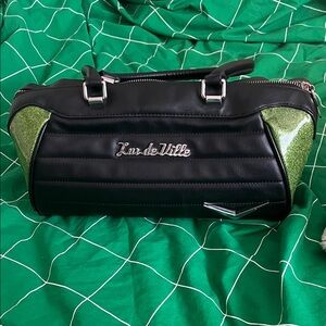 Lux de Ville Black Barrel Bag with Green Glitter Accents